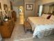 Main bedroom with king bed and access to ensuite bathroom at 25332 Vantage Ln, Punta Gorda, FL 33983