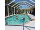 Inviting swimming pool with screened enclosure at 25332 Vantage Ln, Punta Gorda, FL 33983