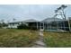 Single-story home with fenced pool and backyard at 1022 Campbell St, Port Charlotte, FL 33953