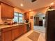 Kitchen with granite countertops and wood cabinets at 1022 Campbell St, Port Charlotte, FL 33953