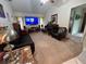 Spacious living room featuring a large TV and comfortable seating at 1022 Campbell St, Port Charlotte, FL 33953