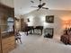 Living room with a piano, two chairs, and a dog cage at 1022 Campbell St, Port Charlotte, FL 33953