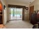 View of the pool from the living room through sliding doors at 1022 Campbell St, Port Charlotte, FL 33953