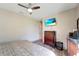 Serene bedroom with king bed, dresser, and access to hallway at 1041 Harbour Park Ct, Punta Gorda, FL 33983