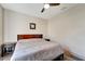 Large bedroom with king bed, nightstand, and ceiling fan at 1041 Harbour Park Ct, Punta Gorda, FL 33983