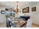 Elegant dining room with a rustic wooden table and chandelier at 1041 Harbour Park Ct, Punta Gorda, FL 33983