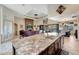 Spacious kitchen island with granite countertops and breakfast bar at 1041 Harbour Park Ct, Punta Gorda, FL 33983