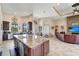 Large kitchen with granite island and open layout to living room at 1041 Harbour Park Ct, Punta Gorda, FL 33983