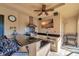 Outdoor kitchen with granite countertops, stainless steel appliances, and a large TV at 1041 Harbour Park Ct, Punta Gorda, FL 33983