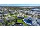 Aerial view of home on canal with pool and nearby community at 1099 Cimarron Dr, Punta Gorda, FL 33950