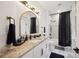 Elegant bathroom with a granite countertop and black accents at 1099 Cimarron Dr, Punta Gorda, FL 33950