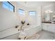 Luxurious bathroom with a large soaking tub and separate shower at 1099 Cimarron Dr, Punta Gorda, FL 33950