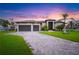 Stunning curb appeal at sunset at 1099 Cimarron Dr, Punta Gorda, FL 33950