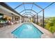 Inviting screened pool and patio with lounge seating at 1099 Cimarron Dr, Punta Gorda, FL 33950