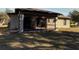 Rear view of house showcasing screened porch and landscaping at 1101 Victoria Ave, Port Charlotte, FL 33948