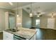 Kitchen island with double sink and view into living room at 1101 Victoria Ave, Port Charlotte, FL 33948