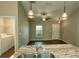 Kitchen island with double sink and view into living room at 1101 Victoria Ave, Port Charlotte, FL 33948