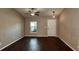 Living room with dark hardwood floors and ceiling fan at 1101 Victoria Ave, Port Charlotte, FL 33948