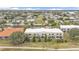 Aerial view of a two-story building complex with a pond nearby at 1246 Rio De Janeiro Ave # 509, Punta Gorda, FL 33983