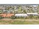 Aerial view of two-story building with orange tile roofs, surrounded by lush landscaping at 1246 Rio De Janeiro Ave # 509, Punta Gorda, FL 33983