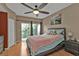 Bright bedroom with a comfortable bed and access to a private balcony at 1246 Rio De Janeiro Ave # 509, Punta Gorda, FL 33983