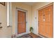 Two orange doors with storm door and welcome mat at 1246 Rio De Janeiro Ave # 509, Punta Gorda, FL 33983