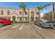 Front view of a two-story building with palm trees at 1246 Rio De Janeiro Ave # 509, Punta Gorda, FL 33983