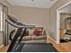 Home office with a treadmill and couch near a bathroom at 1246 Rio De Janeiro Ave # 509, Punta Gorda, FL 33983