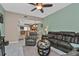 Open living room with a view of the kitchen and access to a patio at 1246 Rio De Janeiro Ave # 509, Punta Gorda, FL 33983