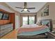 Spacious main bedroom with a ceiling fan and access to a balcony at 1246 Rio De Janeiro Ave # 509, Punta Gorda, FL 33983