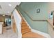 Staircase with wood steps and a light-colored railing at 1246 Rio De Janeiro Ave # 509, Punta Gorda, FL 33983