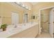 Clean bathroom with double vanity and walk-in shower at 1259 Red Oak Ln, Port Charlotte, FL 33948