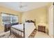 Bright bedroom with double bed, dresser, and nightstand at 1259 Red Oak Ln, Port Charlotte, FL 33948