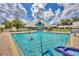 Relaxing community pool with plenty of space for swimming and sunbathing at 1259 Red Oak Ln, Port Charlotte, FL 33948