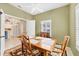 Bright dining room with view into kitchen at 1259 Red Oak Ln, Port Charlotte, FL 33948