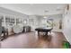 Relaxing game room featuring a pool table and putting green at 1259 Red Oak Ln, Port Charlotte, FL 33948