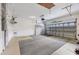 Spacious garage with overhead storage and floor covering at 1259 Red Oak Ln, Port Charlotte, FL 33948