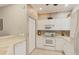 White kitchen boasts ample storage and built-in microwave at 1259 Red Oak Ln, Port Charlotte, FL 33948