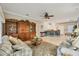 Open living room with tiled floors and built-in shelving at 1259 Red Oak Ln, Port Charlotte, FL 33948