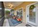 Relaxing screened porch with seating and a tiled floor at 1259 Red Oak Ln, Port Charlotte, FL 33948