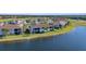 Community overview showcasing homes and lake at 14033 Black Beauty Dr # 511, Punta Gorda, FL 33955