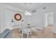 Bright dining room featuring a glass table and white chairs at 14033 Black Beauty Dr # 511, Punta Gorda, FL 33955