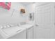 Laundry room with washer, dryer, and shelving at 14033 Black Beauty Dr # 511, Punta Gorda, FL 33955