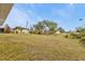 Large backyard with grassy area and shed at 145 Dartmouth Nw Dr, Port Charlotte, FL 33952