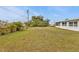 Spacious backyard with grassy area at 145 Dartmouth Nw Dr, Port Charlotte, FL 33952