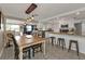 Kitchen with island and adjacent dining area with farmhouse table at 145 Dartmouth Nw Dr, Port Charlotte, FL 33952