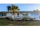 Charming single story home with white picket fence and landscaped yard at 145 Dartmouth Nw Dr, Port Charlotte, FL 33952