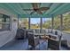 Relaxing screened porch with seating and ceiling fan at 145 Dartmouth Nw Dr, Port Charlotte, FL 33952