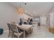 Dining area adjacent to the kitchen features modern lighting, with a view of stainless steel kitchen appliances at 15950 Grassland Ln # 2622, Punta Gorda, FL 33982