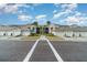 New construction condos featuring attached garages, modern architecture, and nicely landscaped grounds at 15950 Grassland Ln # 2622, Punta Gorda, FL 33982